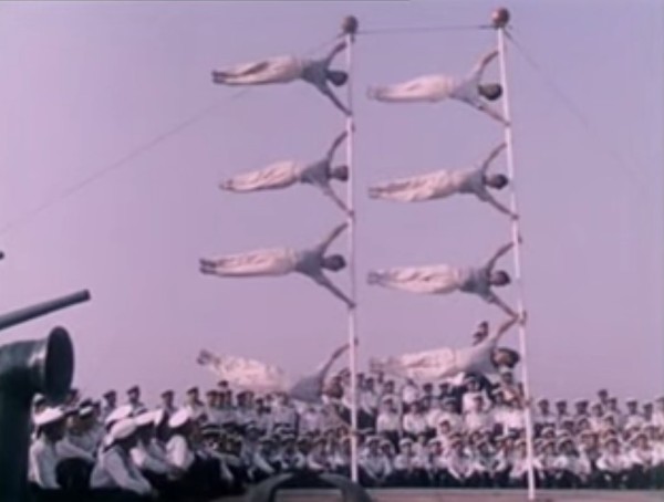 The 'flag,' showing the remarkable core strength of pole acrobats. (Screenshot/YouTube)