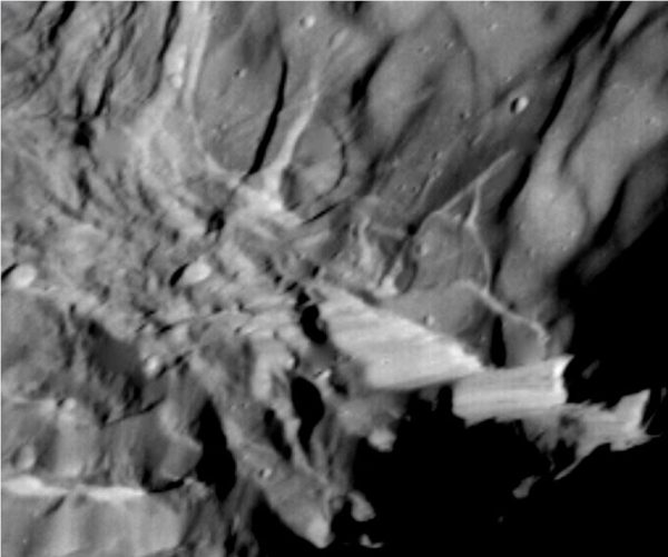The above image of Verona Rupes was captured by the passing Voyager 2 robotic spacecraft in 1986. How the giant cliff was created remains unknown, but is possibly related to a large impact or tectonic surface motion. Image: Voyager 2, NASA
