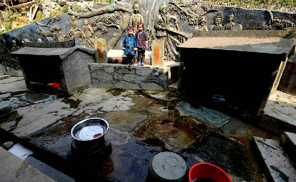 Two wells in the village, one for having boys, the other for having girls. (Image: NTD TV)