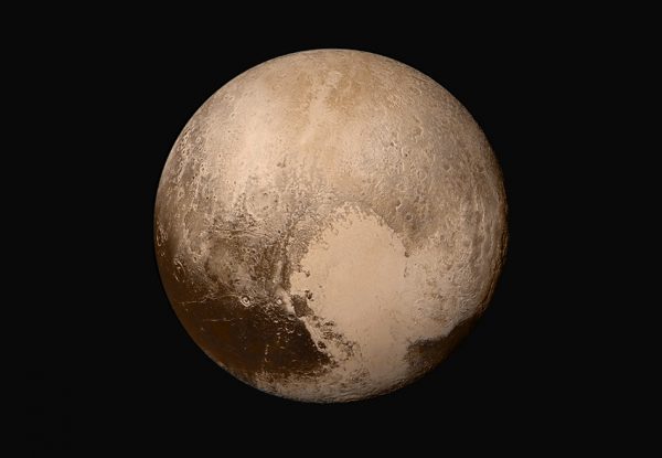 Four images from New Horizons’ Long Range Reconnaissance Imager (LORRI) were combined with color data from the Ralph instrument to create this sharper global view of Pluto. (Image: NASA/JHUAPL/SwRI)