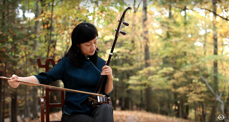 Playing the erhu.