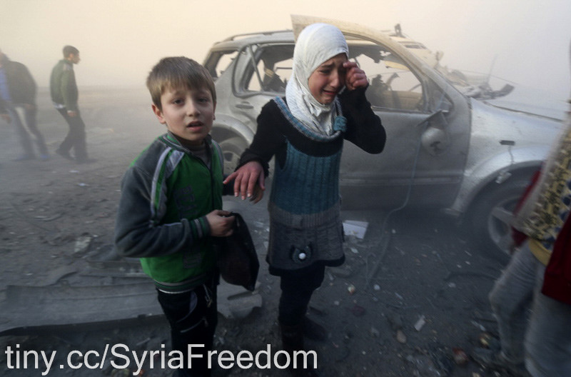 A girl cries near a damaged car at a site hit by what activists said were barrel bombs dropped by government forces in Aleppo's Dahret Awwad neighborhood January 29, 2014. (Image: Freedom House via flickr/CC BY 2.0)