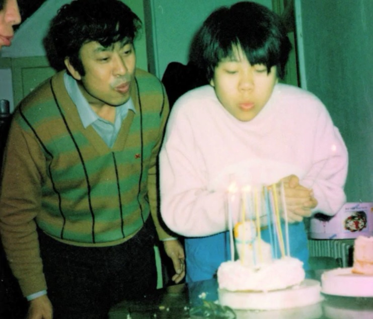 Zhiwen Wang with his daughter, Xiaodan "Danielle" celebrating one of her birthdays. (Image: FreeZhiwenWang via YouTube/Screenshot)