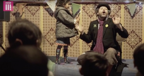 The British group use the power of play to help the kids let go of some anxiety. (Image via BBC Three YouTube/Screenshot)