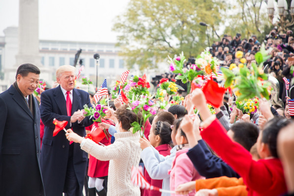 Trump was feted with children waving U.S. and Chinese flags. (Image: flickr / CC0 1.0)