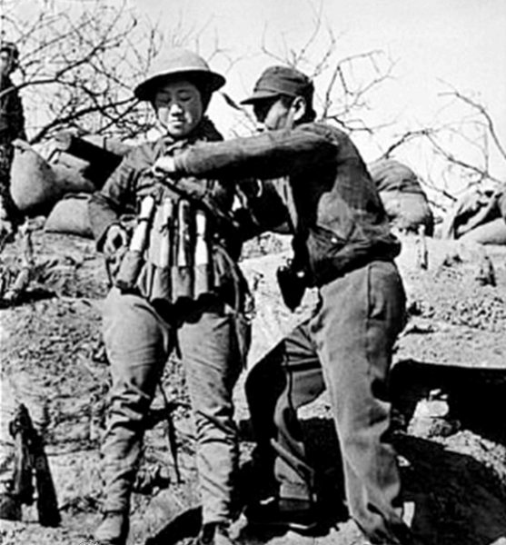 Chinese suicide bomber putting on an explosive vest made out of Model 24 hand grenades to use in an attack on Japanese tanks at the Battle of Taierzhuang. (Image: via wikipedia / CC0 1.0)