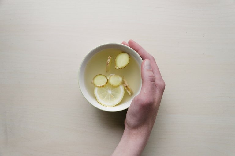 A cup of ginger with lemon tea.