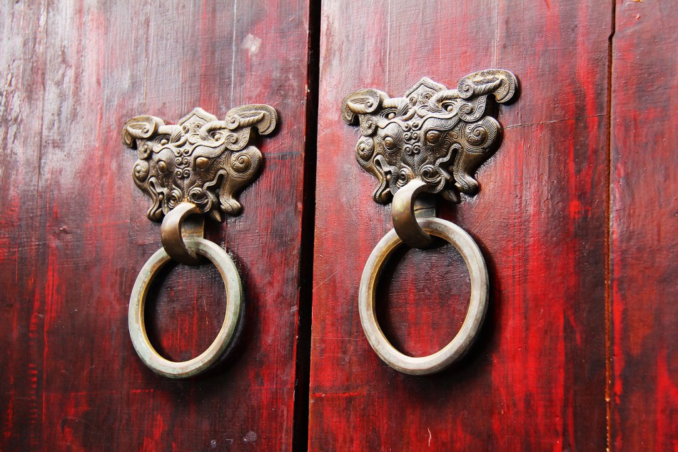 Wooden doors with knockers.