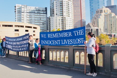 Photo by Tina Wang. In Melbourne on Princes Bridge acknowledging all lives that have been lost.