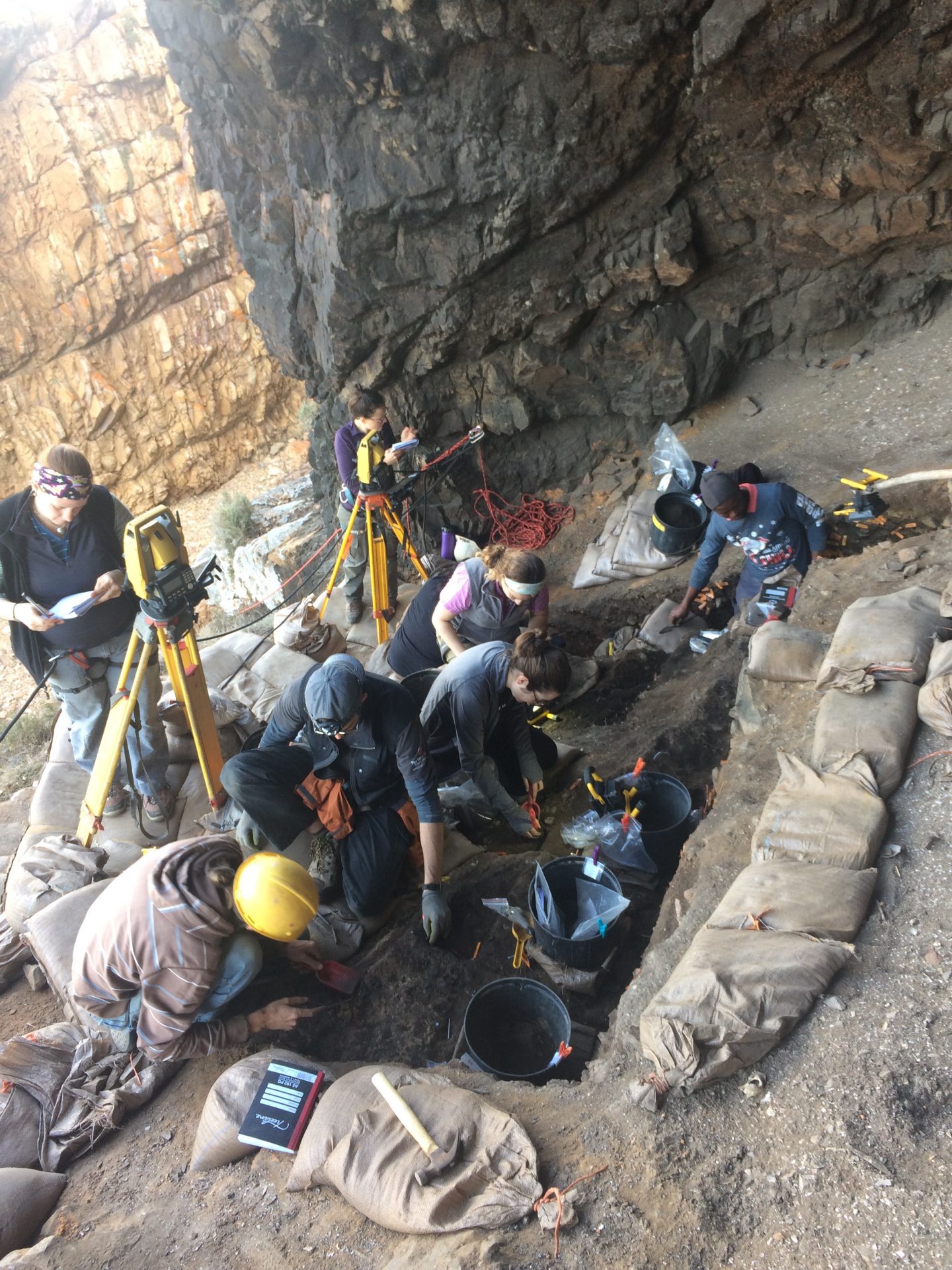 A view of the Knysna archaeological project. Pictured are students Sara Watson (UTA alum 2016), Deanna Dytchkowskyj, Kathryn Lauria, Clancey Butts; professional archaeologists, Nkosi Mgcaleka, Struan Henderson; and visiting scientist Dr. Irene Esteban. (Credit: University of Texas at Arlington)
