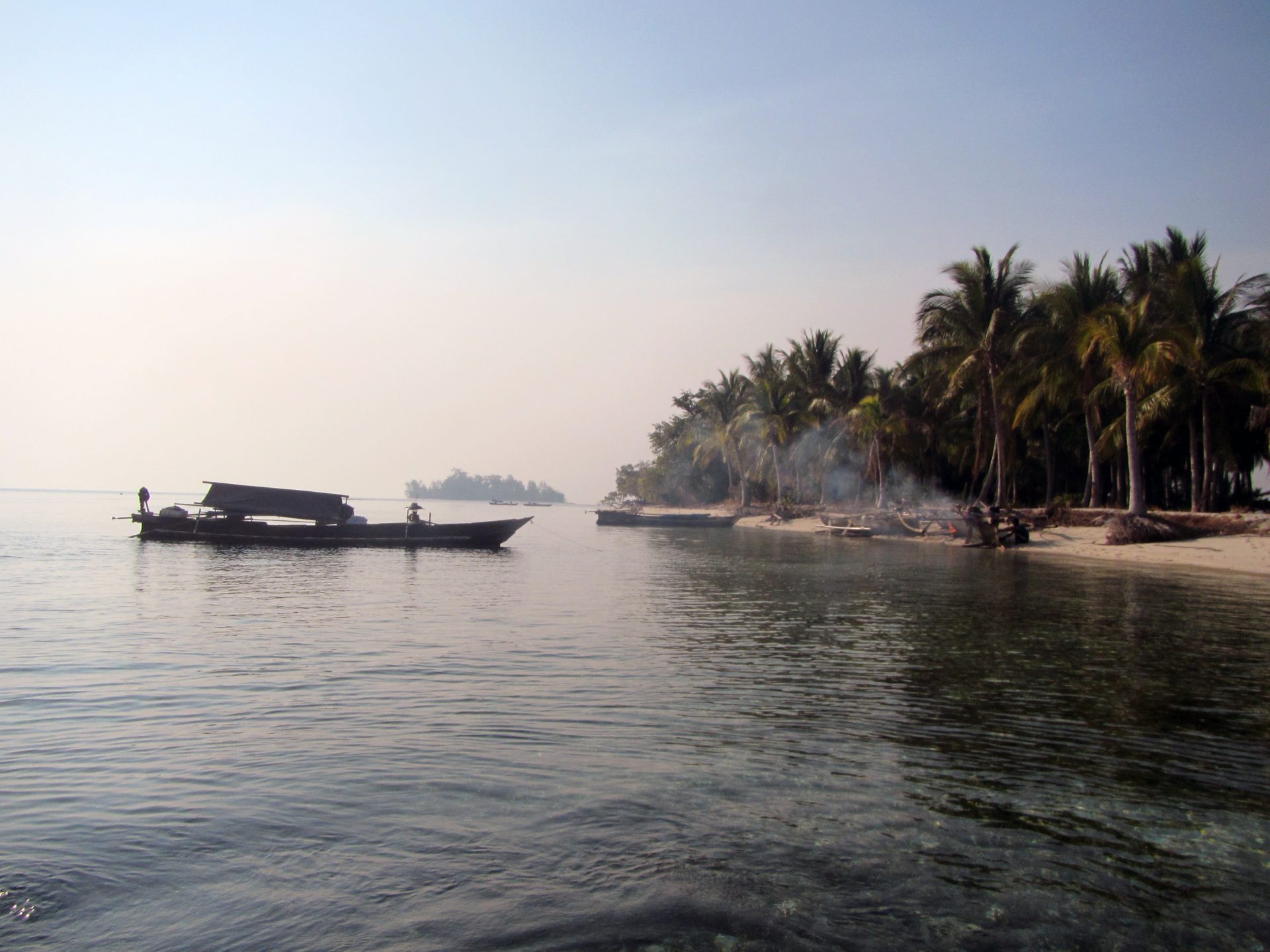 A small, unnamed island serves as a haven for visiting Bajau houseboats. (Photo by Melissa Ilardo)