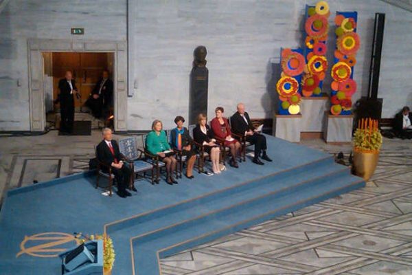 The Nobel Prize for Peace 2010 ceremony: empty chair on the stage booked for Liu Xiaobo, who was in prison on that time; Chinese government also didn't allow Liu Xia travel to Oslo, putting her under house arrest. (Image: wikimedia / CC0 1.0)