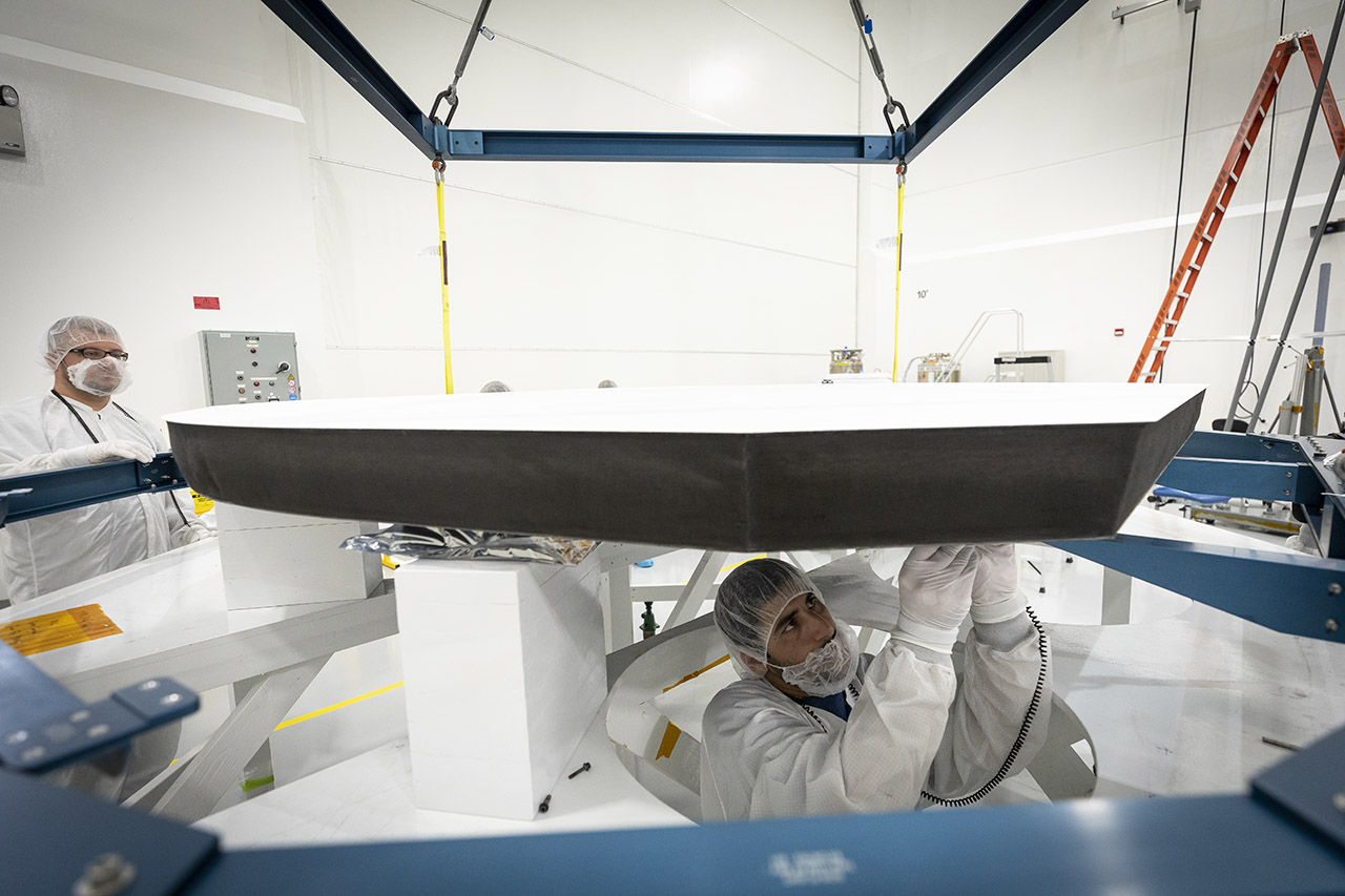 Parker Solar Probe’s heat shield is made of two panels of superheated carbon-carbon composite sandwiching a lightweight 4.5-inch-thick carbon foam core. To reflect as much of the Sun’s energy away from the spacecraft as possible, the Sun-facing side of the heat shield is also sprayed with a specially formulated white coating. (Image: NASA/Johns Hopkins APL/Ed Whitman)