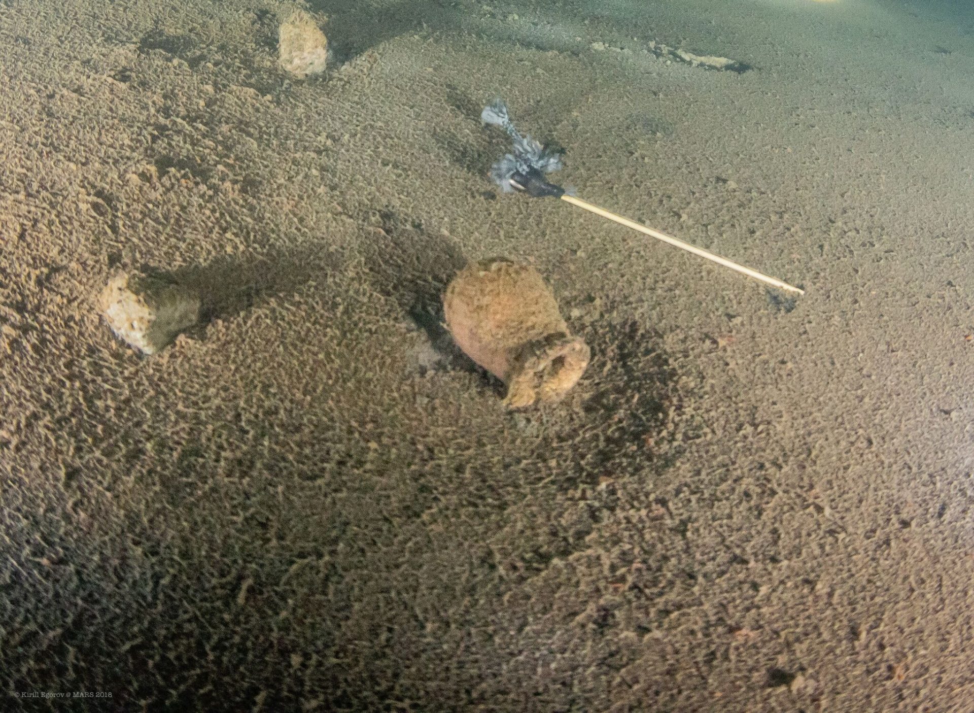 Divers found a hand grenade probably made of ceramic. (Photo: Kirill Egorov / Ocean Discovery / Mars Project)