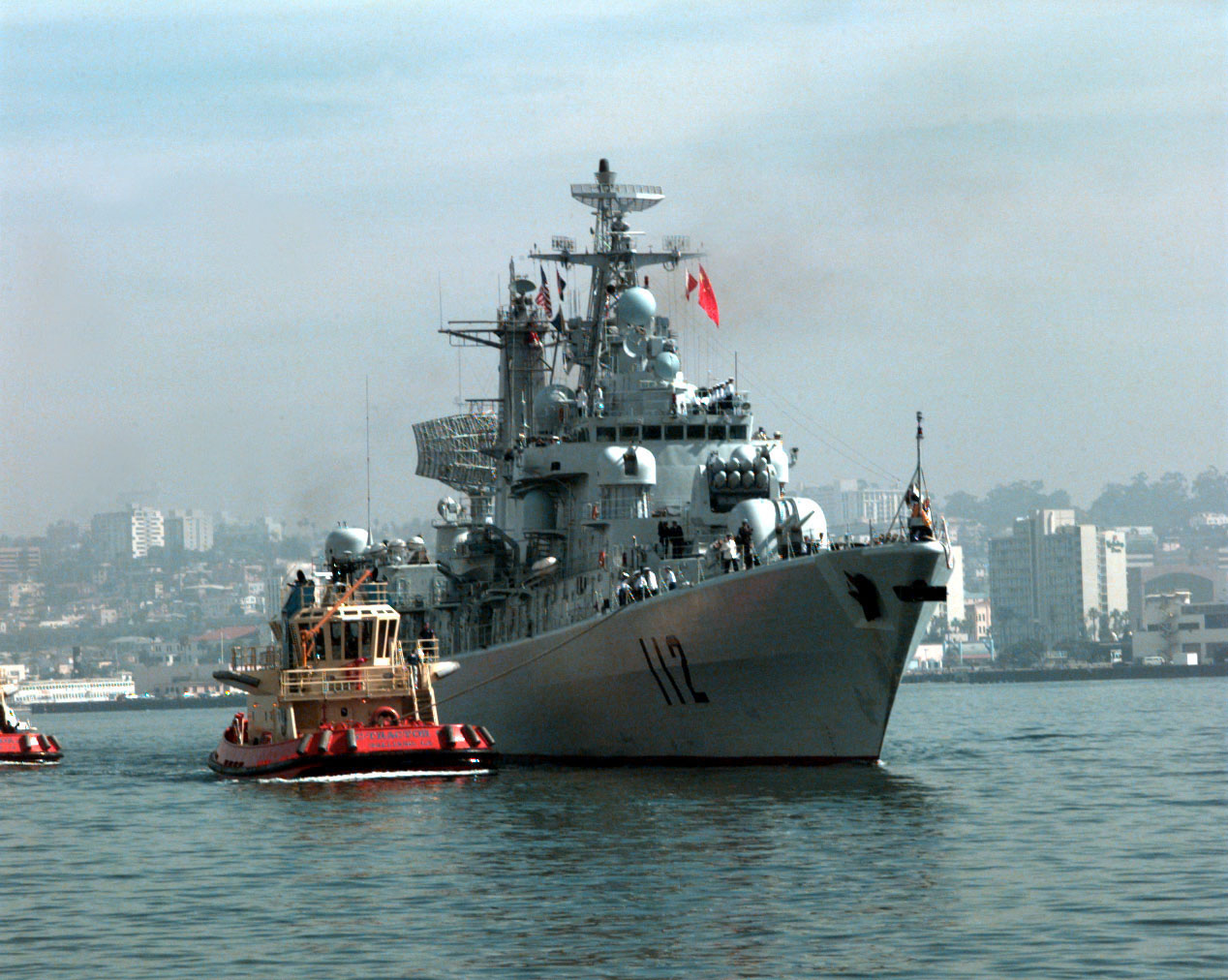 970321-N-4142G-002 The People's Republic of China destroyer Harbin (DD 112) pulls into San Diego, Calif., on March 21, 1997, for a first-ever visit by People's Republic of China Navy ships to the mainland U.S. Harbin and two other People's Republic of China ships are visiting Southern California for the second part of a goodwill visit between the U.S. and Chinese navies. The ships visited Hawaii on their way to San Diego. The U.S. and the People's Republic of China navies are the two largest fleets in the Asia-Pacific region. Interaction between the two navies increases mutual understanding and confidence. During the visit Chinese sailors will have the opportunity to meet their U.S. Navy counterparts, tour U.S. ships and experience American culture in Southern California. The destroyers Harbin and Zhuhai, and supply ship Nancang will moor next to the U. S. Navy's aircraft carrier USS Constellation (CV 64), at Naval Air Station North Island. DoD photo by Petty Officer 2nd Class Felix Garza, U. S. Navy.