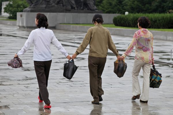 North Korean women carrying merchandise in Pyongyang. The North Korean government emphasized economic development, not ballistic missiles, in a recent National Day celebration. (Image: via Flickr CC BY-SA 2.0)
