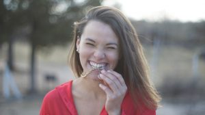 A young woman smiling.
