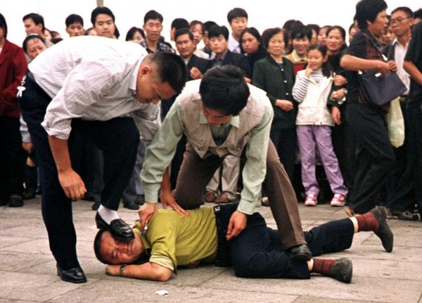"Wherever true socialism or communism has been adopted, it has delivered anguish and devastation and failure.” — President Donald Trump. The photo shows Chinese plainclothes police in Tiananmen Square stamping on the face of a man for protesting the communist regime's persecution of the Falun Gong spiritual practice. (Image: Minghui.org)