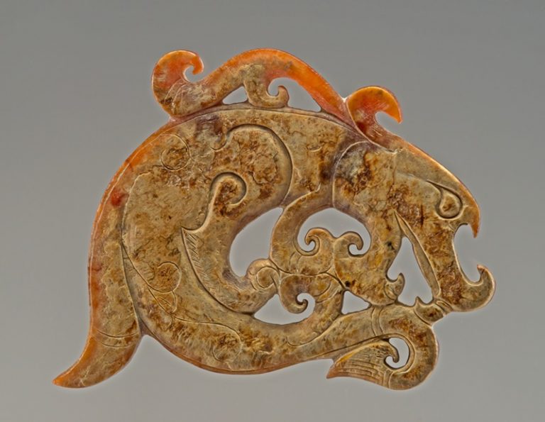 A dragon head-fish body jade ornament from the Spring and Autumn and the Warring States periods.