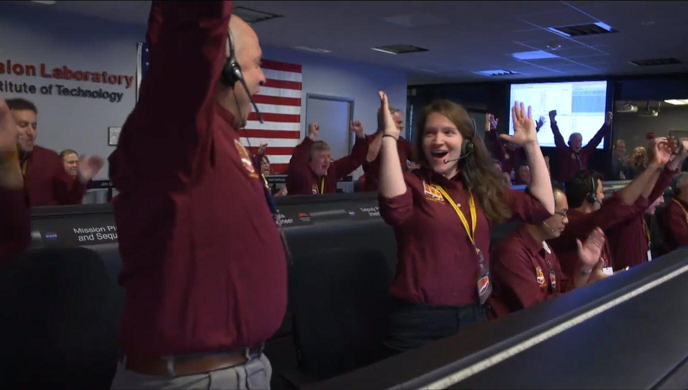The NASA InSight team reacts after receiving confirmation that the spacecraft successfully touched down on the surface of Mars, inside the Mission Support Area at NASA's Jet Propulsion Laboratory in Pasadena, California. (NASA/B. Ingalls)