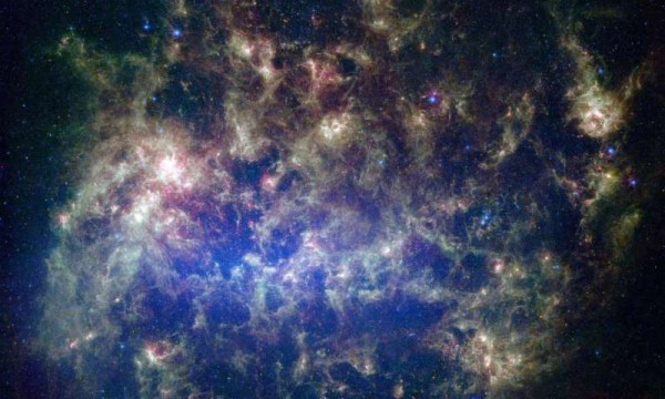 This vibrant image from NASA's Spitzer Space Telescope shows the Large Magellanic Cloud, a satellite galaxy to our own Milky Way galaxy. (Credit: NASA/JPL-Caltech/STScI)