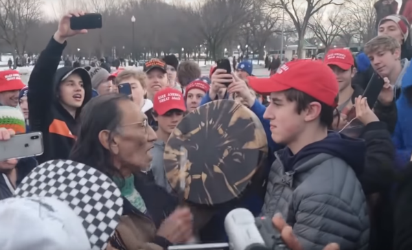 “You won’t get any further reaction of aggression, and I’m willing to stand here as long as you want to hit this drum in my face,” said Sandmann in explanation of his expression. (Image: YouTube/Screenshot)