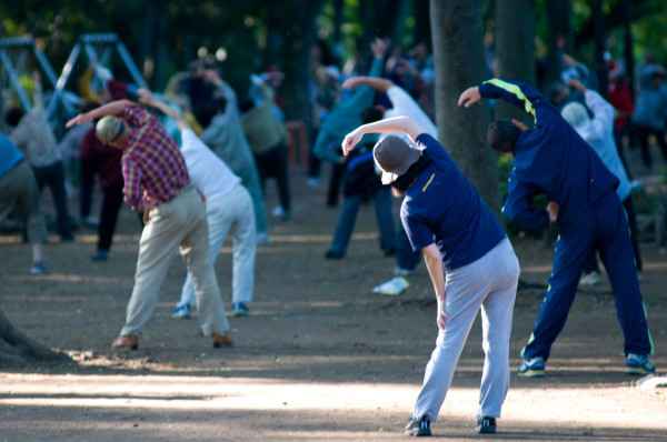 Morning “Radio Exercise” in a park in Japan. (Image: James Justin via flickr CC BY-NC-ND 2.0 )