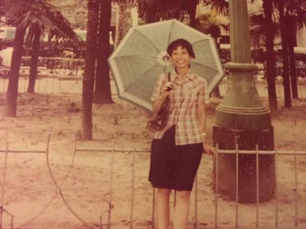 Lady standing before a park. Shanghai 1980s. (Image Credit: Susan Ruel)
