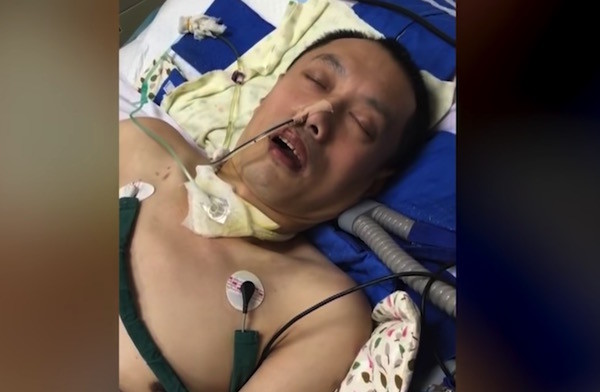 A still from video footage taken of a Falun Gong practitioner Hu Guojian who was in a coma after being tortured. (Image: YouTube/Fox 11)