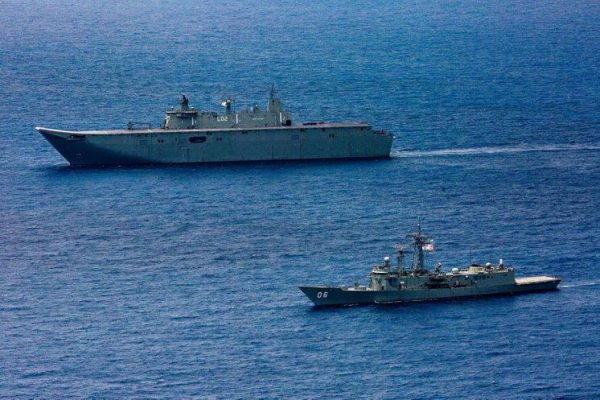 The HMAS Canberra and HMAS Newcastle sail in formation during Indo-Pacific Endeavour 2019. (Image: Navy Daily / CC0 1.0)