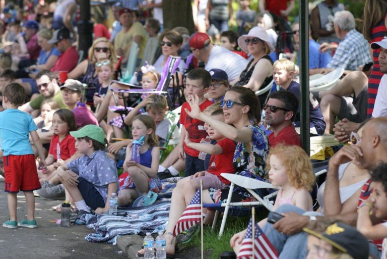 Cheering for the red, white, and blue.