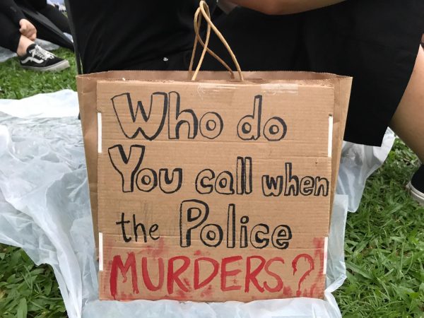Paper Bag of a Hong Kong Protester, saying "who do you call when the police murders?