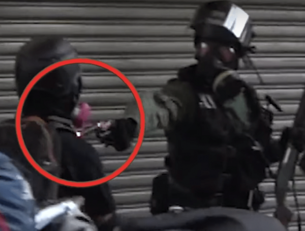 During a clash, an officer fired a bullet into the chest of an 18-year-old named Tsang Chi-kin. (Image: YouTube/Screenshot)