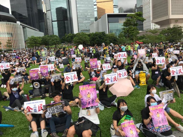 Hong Kong protesters gather in a park to peacefully protest, demanding the five things. 