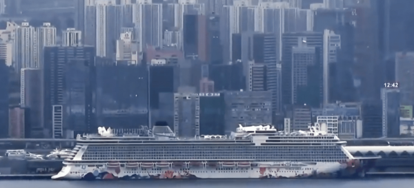 In Hong Kong, 3,600 people remain quarantined on a cruise ship as officials conduct health checks, after eight former passengers tested positive for the novel coronavirus. (Image: YouTube/Screenshot)