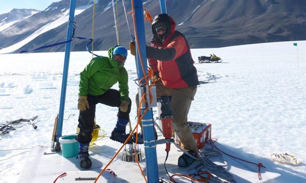 Researchers including Michael Dyonisius, left, drill ice cores in Antarctica. The researchers used the ice cores to determine how much of the potent greenhouse gas methane from ancient carbon deposits might be released to the atmosphere in warming conditions. (University of Rochester image / Vasilii Petrenko)