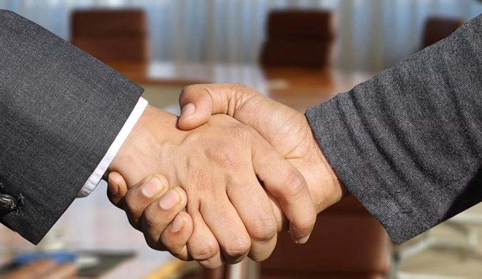 Two businessmen shaking hands.