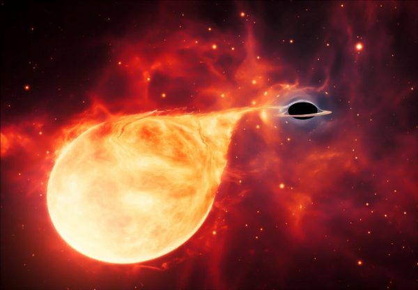 This artist's impression depicts a star being torn apart by an intermediate-mass black hole (IMBH), surrounded by an accretion disc. This thin, rotating disc of material consists of the leftovers of a star which was ripped apart by the tidal forces of the black hole. (Image: ESA/Hubble, M. Kornmesser)