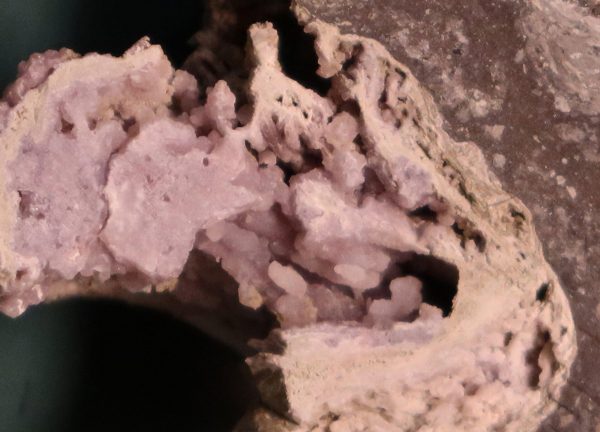 Close-up view of hydrothermal minerals (silica and feldspar) in impact melt rock. (Image: David A. Kring)