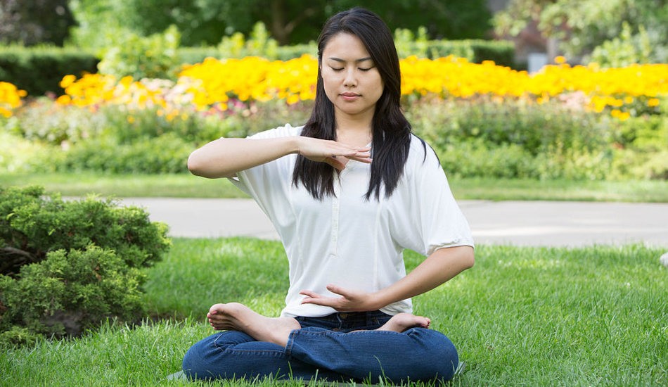 A young woman meditating.