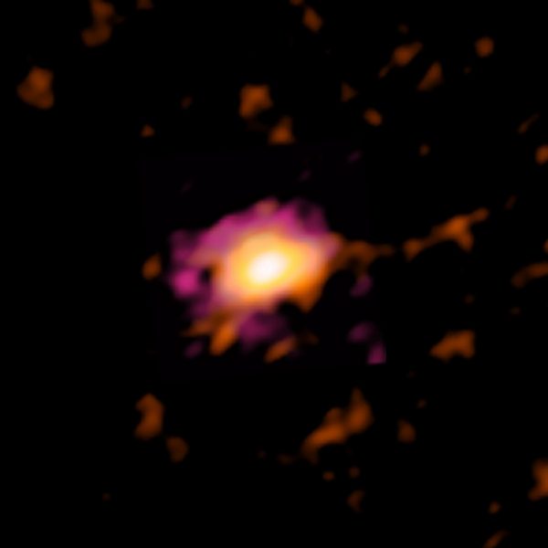 ALMA radio image of the Wolfe Disk, seen when the universe was only ten percent of its current age. (Credit: ALMA (ESO/NAOJ/NRAO), M. Neeleman; NRAO/AUI/NSF, S. Dagnello)