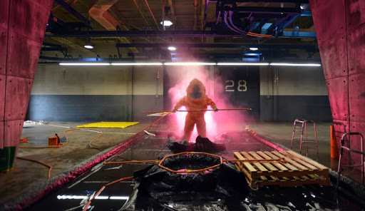 A person in a decontamination suit.