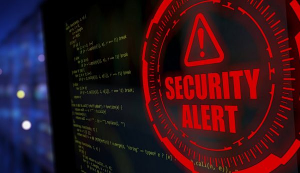 A computer screen displays a security alert.