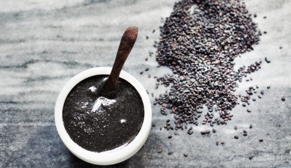 A paste made from black sesame in a white bowl.