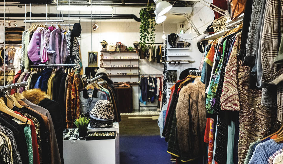 Racks of clothing in a store.