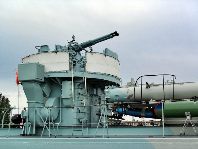 An antiaircraft gun aboard a destroyer escort vessel.