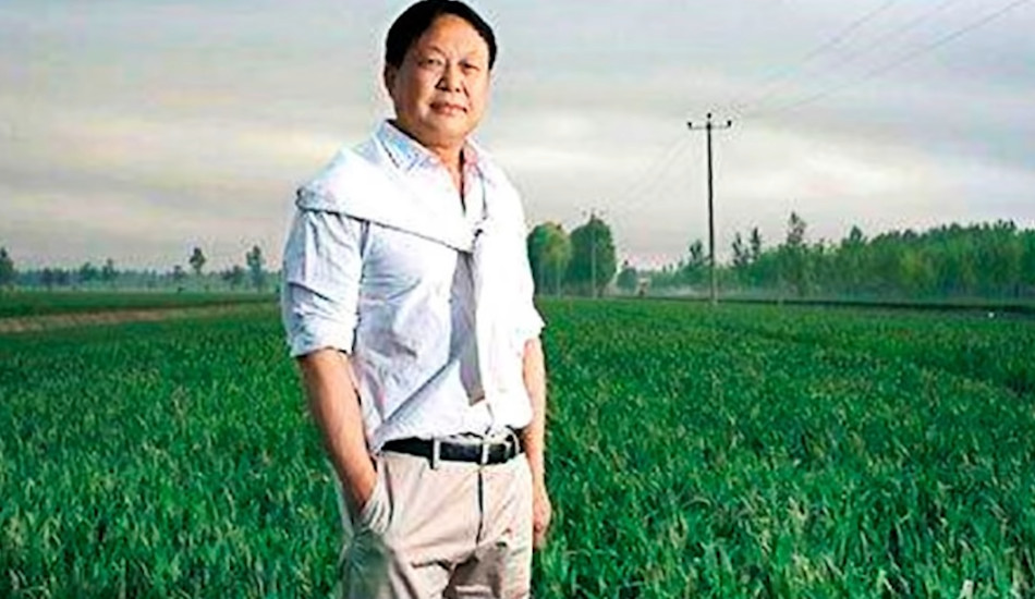 Sun Dawu standing in a field.