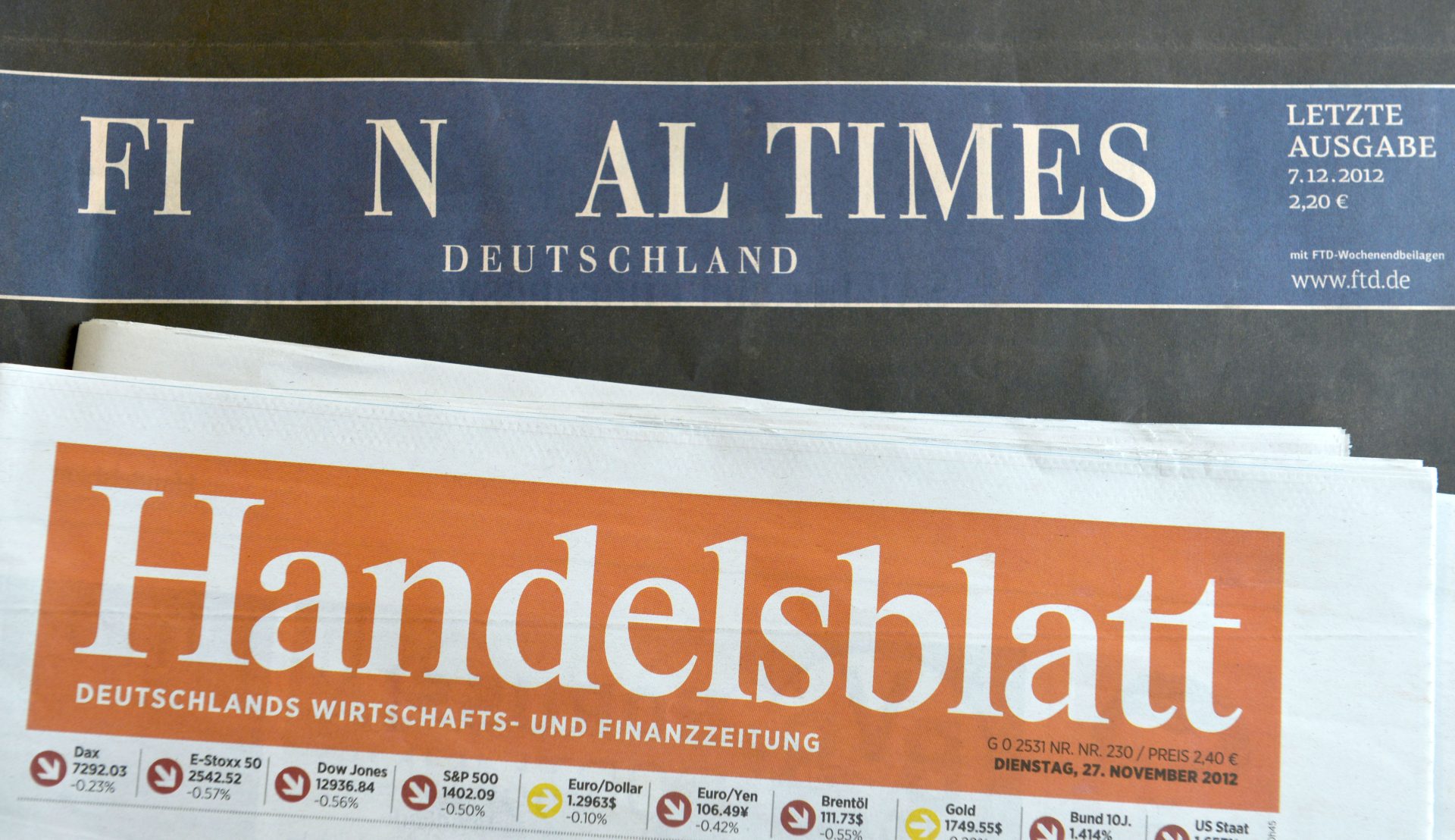 HAMBURG, GERMANY - DECEMBER 07: The final issue of the Financial Times Deutschland daily newspaper is seen on a issue of the Handelsblatt, its biggest competitioner, on December 7, 2012 in Hamburg, Germany. Gruner + Jahr launched the paper in 2000 and its management recently decided to cease publication given that the paper had failed every year to make a profit. Germany has been hit by several media bankruptcies in recent months, including the Frankfurter Rundschau daily newspaper and the DAPD news agency. (Photo by Patrick Lux/Getty Images)