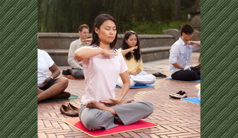 A group of people meditating.