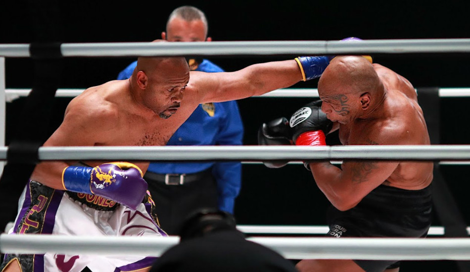 Mike Tyson in the ring with Roy Levesta Jones Jr.